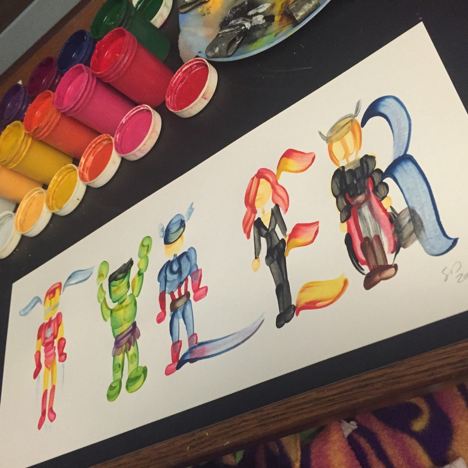 Colorful super hero characters featuring the name "TYLER"
